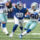 Dec 19, 2021; East Rutherford, New Jersey, USA; Dallas Cowboys running back Tony Pollard (20) carries the ball as New York Giants defensive end Leonard Williams (99) pursues during the second half at MetLife Stadium.